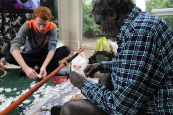 2017 Visiting Fellow Raymond Bulambula guides UVA art students through the process of making a Marratjiiri Morning Star pole