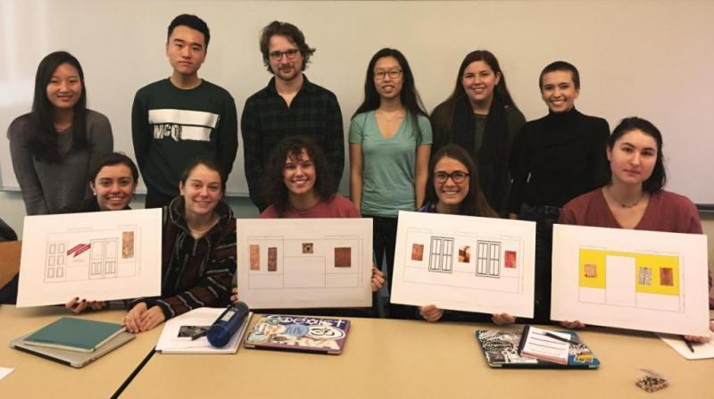 atorial Lab students design the layout for their exhibition at Kluge-Ruhe. Photo by Henry Skerritt.